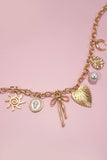 SUN BOW PEARL CROSS DISC U CHARM NECKLACE
