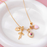 Multi Charm Porcelain Bow Ball Chain Necklace
